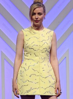 Gillian Jacobs sexy in yellow mini dress at the International Series Mania Festival